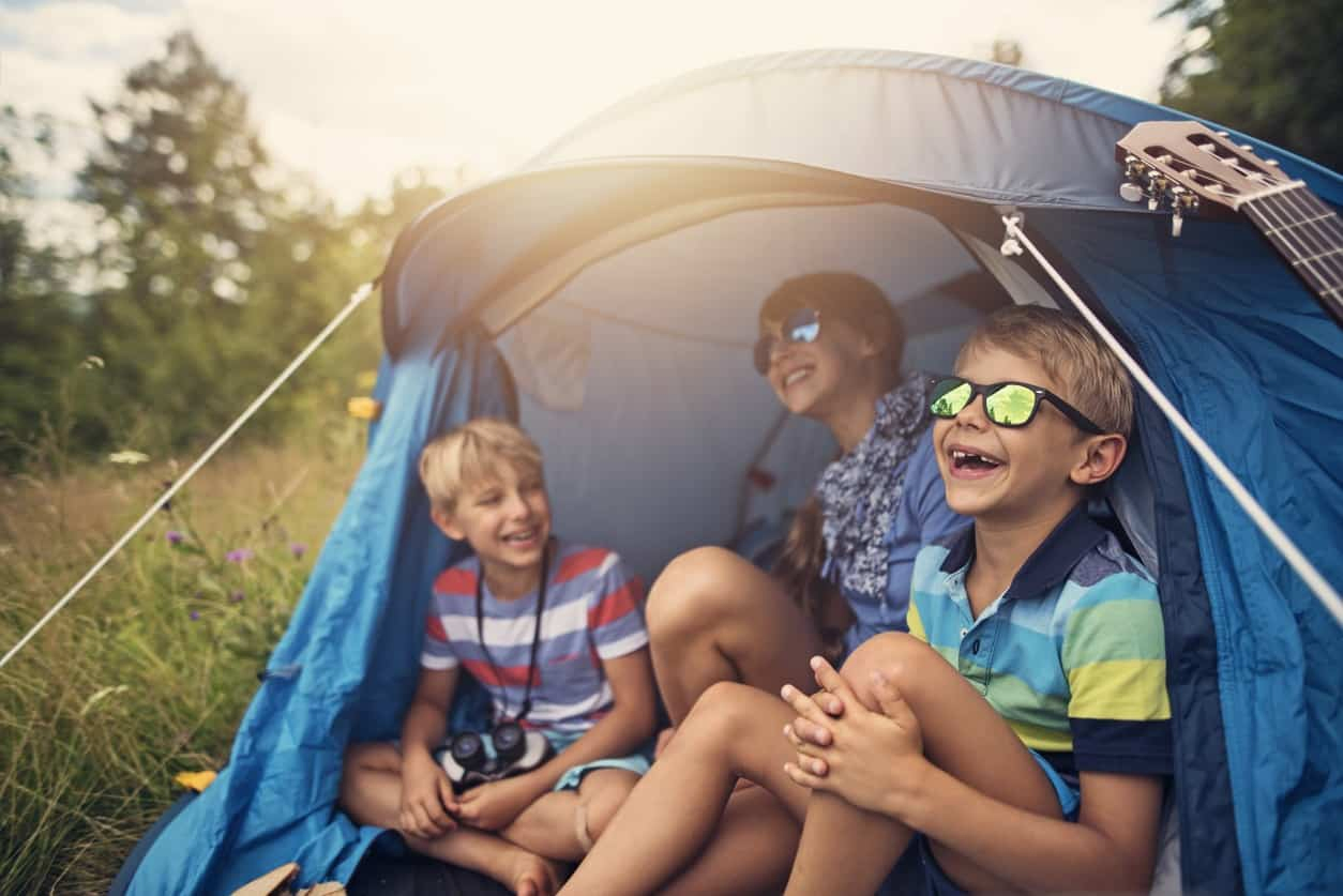 kids camping outdoors in tent