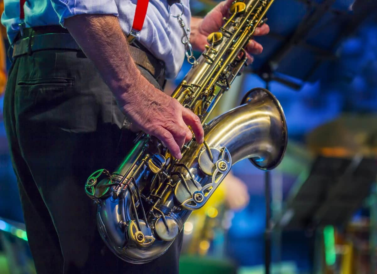 man playing saxophone at jazz festival